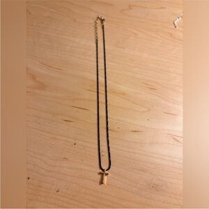 Black and gold cross necklace